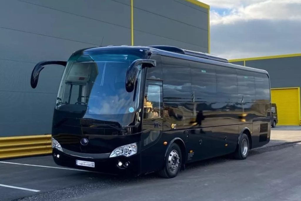 Minibus rental in Paris with a professional chauffeur for group transportation.